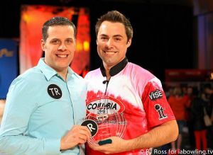 Scott Norton, right, shares his victory with his husband, Craig Woodward. Photo: RJ Ross via Outsports.